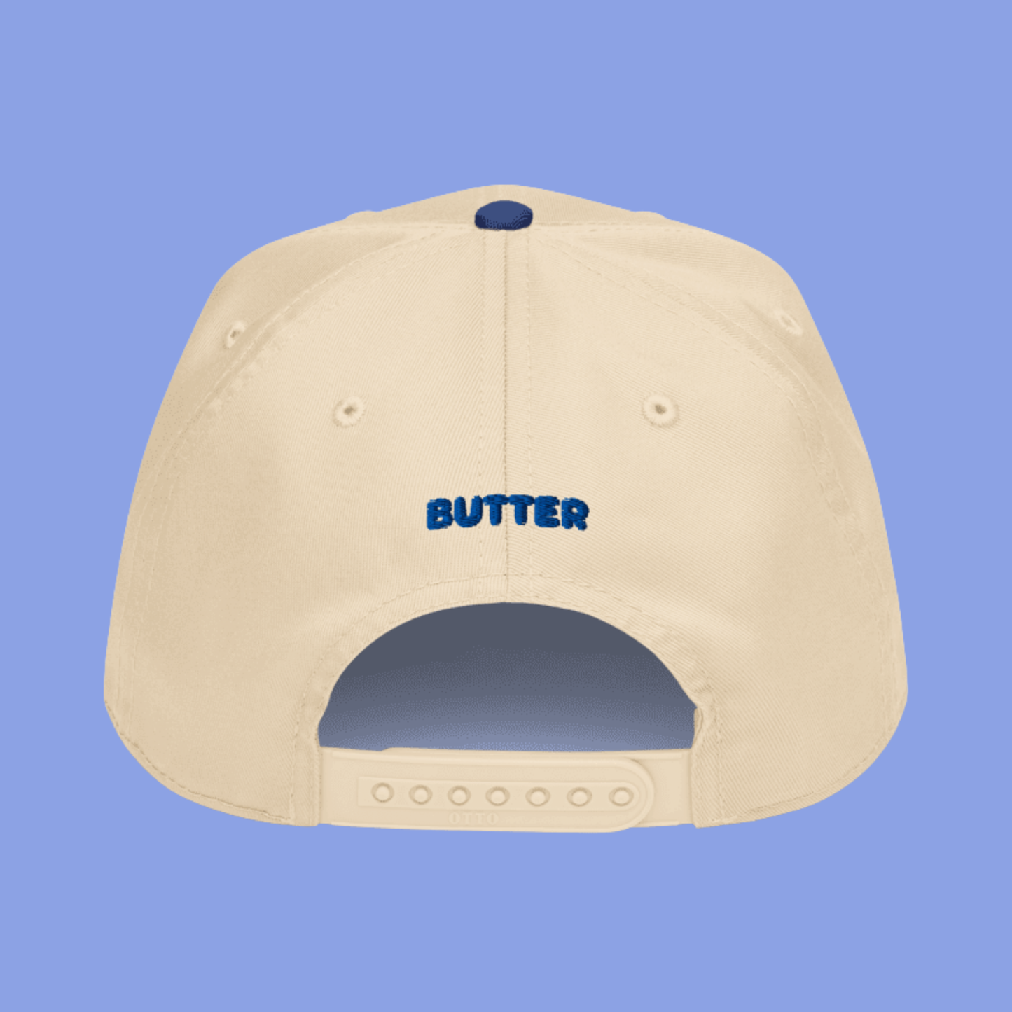 Beige hat with "butter" written in blue