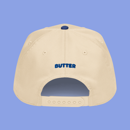 Beige hat with "butter" written in blue